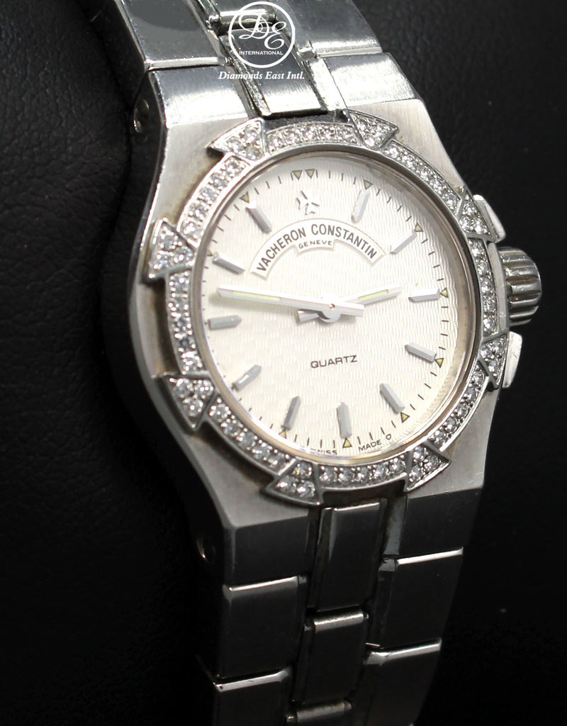 Vacheron Constantin Overseas 16550-423A-8490 Factory Diamonds Ladies BOX/PAPERS Details:    Make:Vacheron Constantin Model: Vacheron Constantin 16550-423A-8490 Overseas Includes: Boxes & Papers Condition: Preowned MINT Movement: Quartz Movement  Water-Resistance: 100 Meters/ 330 feet Material:  Stainless Steel Case Size: 24.5mm  Crystal: Sapphire Crystal (Scratch Resistant) Dial: Silver  Bezel:  Vacheron Constantin Factory Diamond Bezel  Bracelet: Stainless Steel  Clasp:  Deployment Buckle   