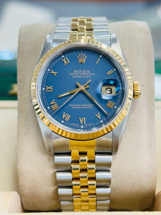 
Rolex Datejust 16233 Blue Stella Roman Dial 18k Gold / Steel Jubilee Band Watch