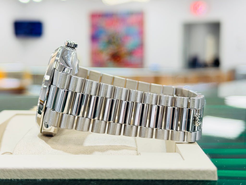 Rolex Day-Date 40 228206 Platinum Smooth Bezel  Factory Black Baguette Diamond Dial  PreOwned Box and Papers - Diamonds East Intl.