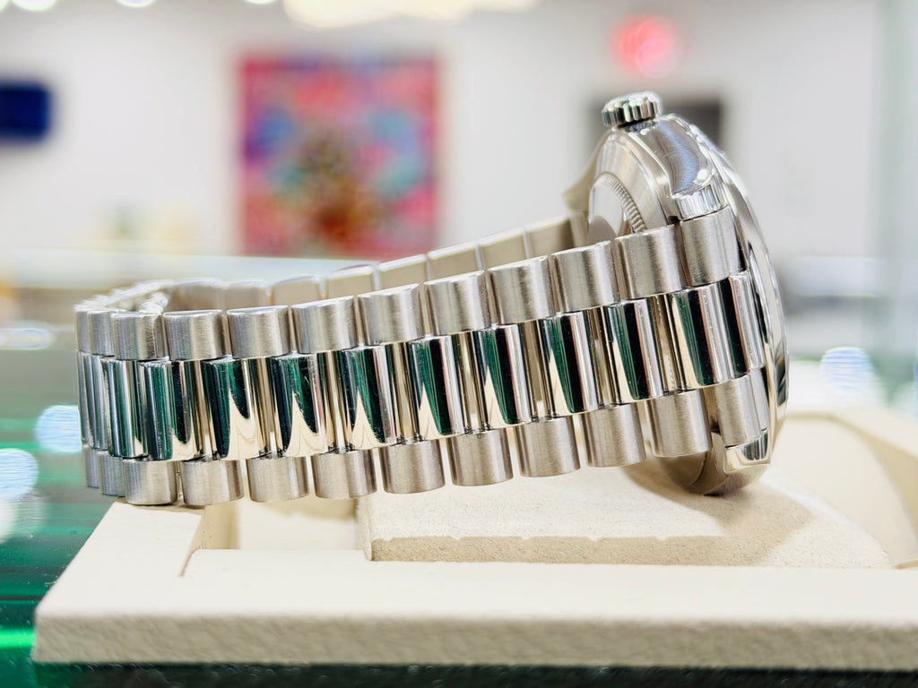 Rolex Day-Date 40 228206 Platinum Smooth Bezel  Factory Black Baguette Diamond Dial  PreOwned Box and Papers - Diamonds East Intl.