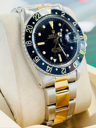 Rolex GMT-Master 40 1675  Stainless & Gold Oyster Black Dial  Vintage 5 Million Serial PreOwned - Diamonds East Intl.