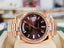 PreOwned Rolex Day-Date 40mm Everrose Gold 228235 Factory Chocolate Baguette Dial Box/Papers - Diamonds East Intl.