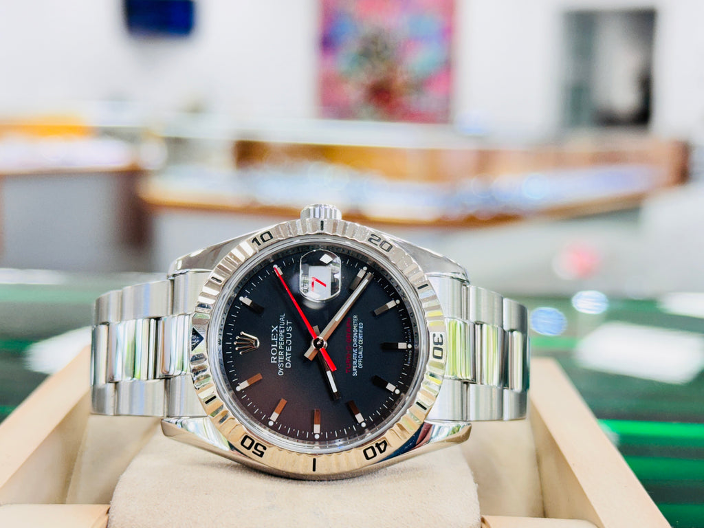 Rolex Datejust 116264 Turn-O-Graph Black Dial  Steel 18K Gold Bezel  PreOwned Box & Papers - Diamonds East Intl.