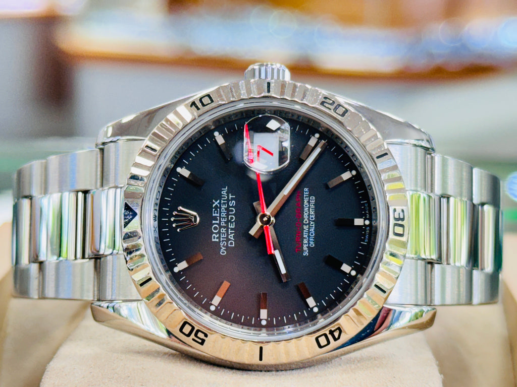 Rolex Datejust 116264 Turn-O-Graph Black Dial  Steel 18K Gold Bezel  PreOwned Box & Papers - Diamonds East Intl.