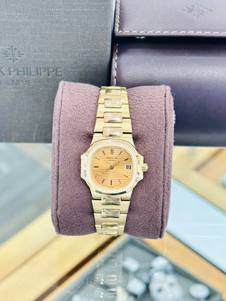 Patek Philippe Nautilus 4700/1j  Ladies 26 Champagne PreOwned - Diamonds East Intl.