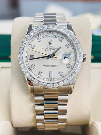 Rolex Day-Date 36 118239 Factory Silver Baguette Diamond Dial  Custom Diamond Bezel PreOwned - Diamonds East Intl.