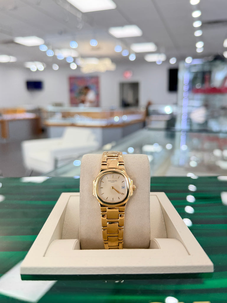 Patek Philippe Nautilus 4700/1j Ladies 26 Ivory Dial Yellow Gold PreOwned - Diamonds East Intl.