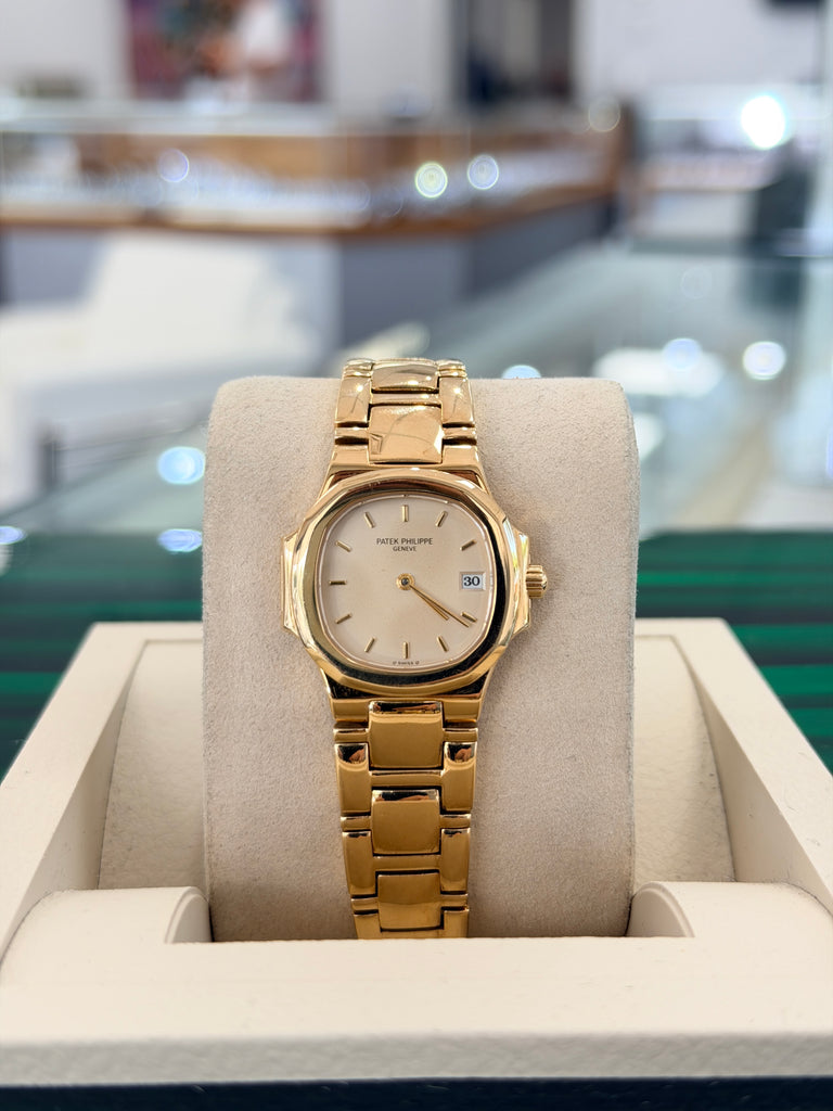 Patek Philippe Nautilus 4700/1j Ladies 26 Ivory Dial Yellow Gold PreOwned - Diamonds East Intl.