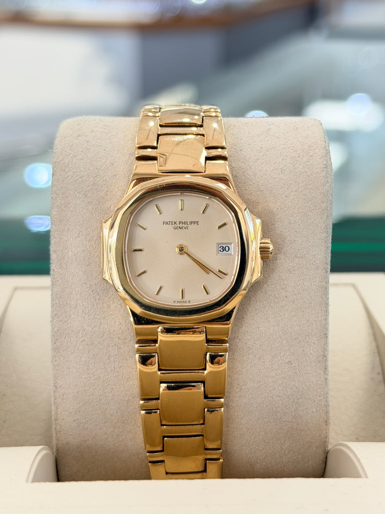 Patek Philippe Nautilus 4700/1j Ladies 26 Ivory Dial Yellow Gold PreOwned - Diamonds East Intl.