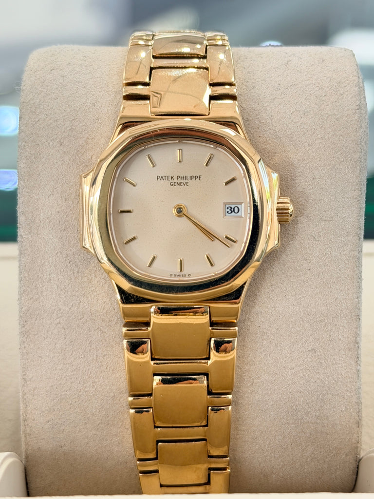 Patek Philippe Nautilus 4700/1j Ladies 26 Ivory Dial Yellow Gold PreOwned - Diamonds East Intl.