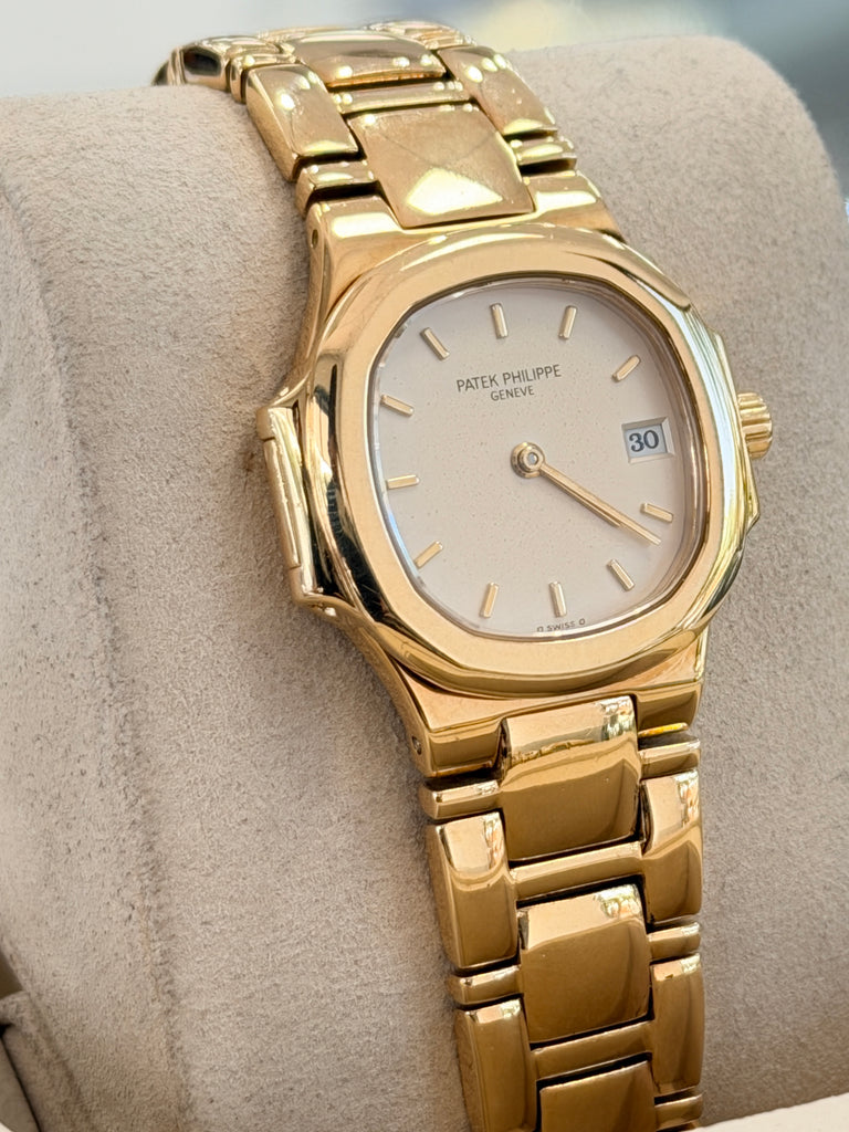 Patek Philippe Nautilus 4700/1j Ladies 26 Ivory Dial Yellow Gold PreOwned - Diamonds East Intl.