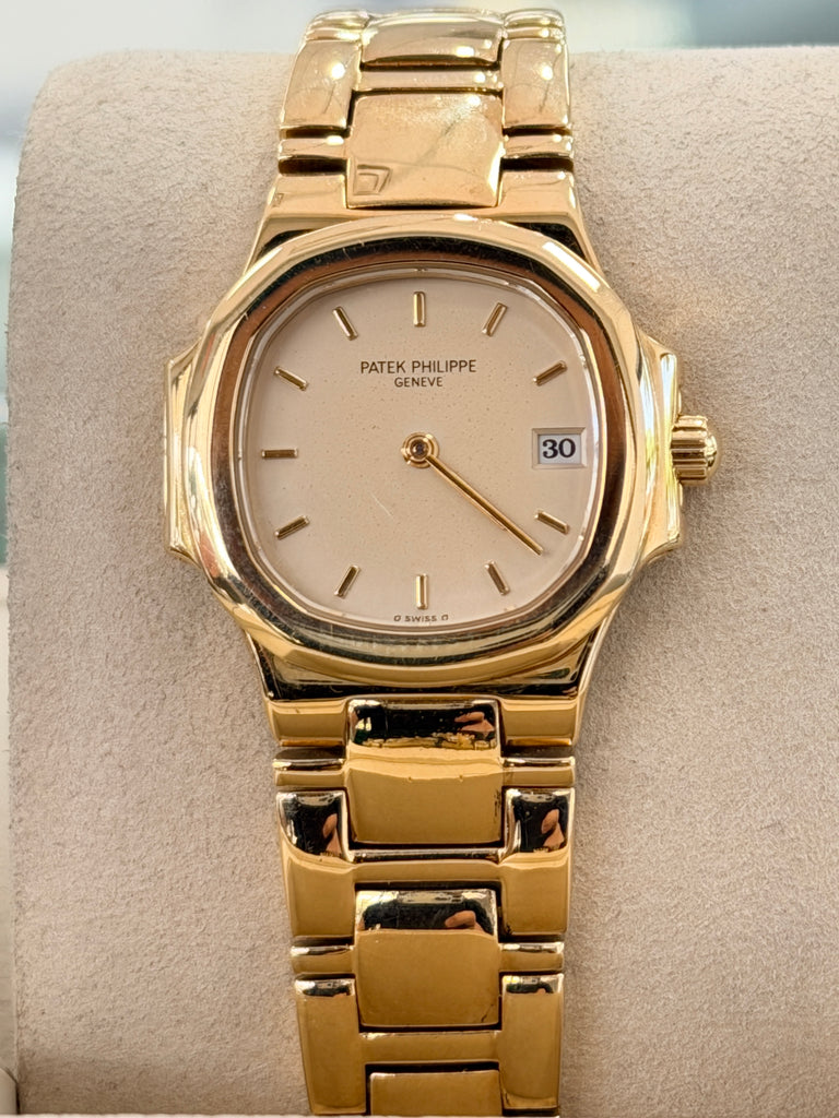 Patek Philippe Nautilus 4700/1j Ladies 26 Ivory Dial Yellow Gold PreOwned - Diamonds East Intl.