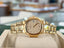 Patek Philippe Nautilus 4700/1j Ladies 26 Ivory Dial Yellow Gold PreOwned - Diamonds East Intl.