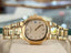 Patek Philippe Nautilus 4700/1j Ladies 26 Ivory Dial Yellow Gold PreOwned - Diamonds East Intl.