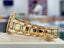 Patek Philippe Nautilus 4700/1j Ladies 26 Ivory Dial Yellow Gold PreOwned - Diamonds East Intl.