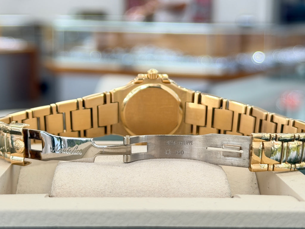 Patek Philippe Nautilus 4700/1j Ladies 26 Ivory Dial Yellow Gold PreOwned - Diamonds East Intl.