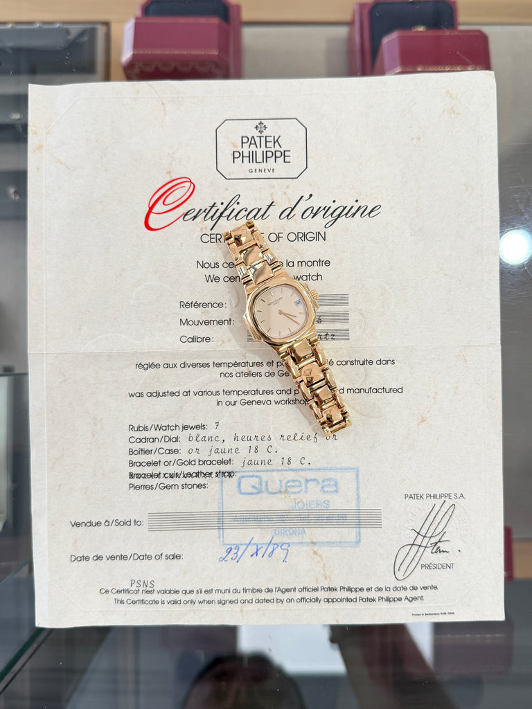 Patek Philippe Nautilus 4700/1j Ladies 26 Ivory Dial Yellow Gold PreOwned - Diamonds East Intl.
