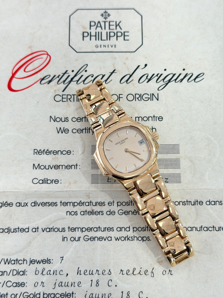 Patek Philippe Nautilus 4700/1j Ladies 26 Ivory Dial Yellow Gold PreOwned - Diamonds East Intl.
