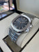Patek Philippe Nautilus 5711 Blue Dial Box and Papers PreOwned - Diamonds East Intl.