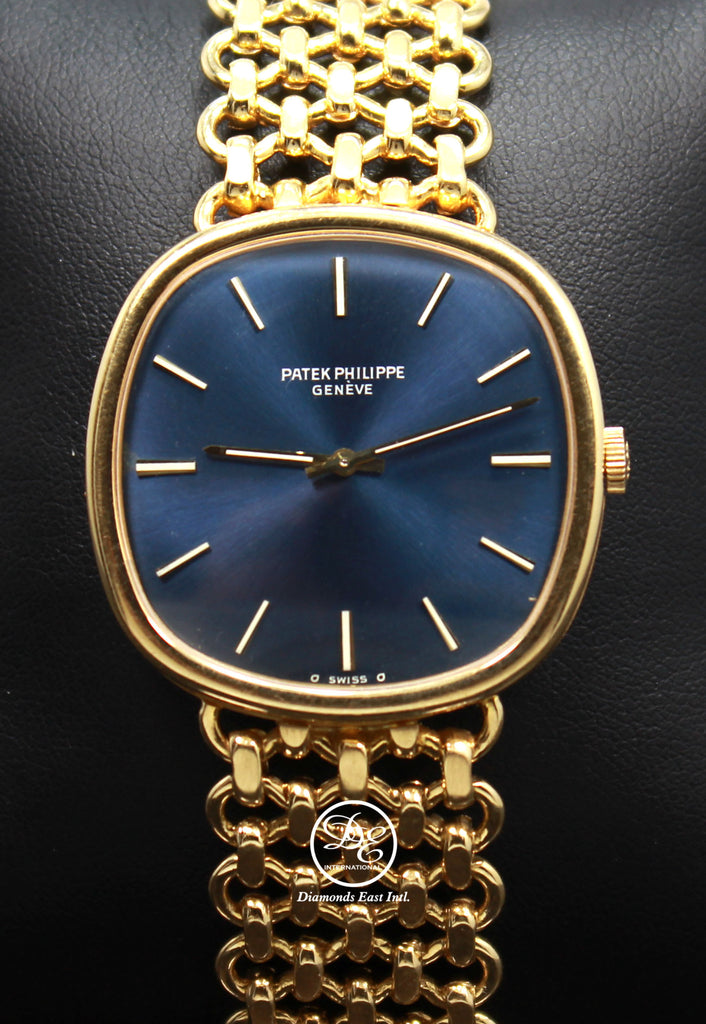 PATEK PHILIPPE Ellipse 3844 Circa 1980s 18k Yellow Gold Rare Collector's Watch  Make:PATEK PHILIPPE  Model: PATEK PHILIPPE Ellipse 3844  Movement: Manual movement  Material:  18k Yellow Gold  Case Size: 33mm Case thickness: 7mm Dial: Blue Bezel:  18k Yellow Gold  Bracelet: Patek Philippe 18k yellow gold Band, FULLY LINKED!  Fits up to a 8-8.25’’ wrist.  No box/papers, will be shipped in a beautiful watch Box and Certified Appraisal. Archive papers can be ordered from Patek Philippe Directly  ,