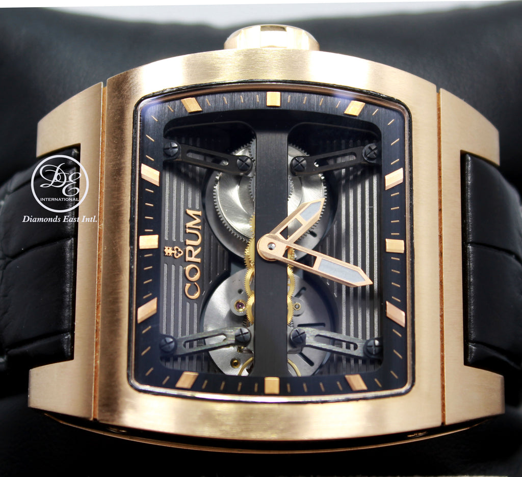 Make: CORUM  Model: 207.201.05/0F01 0000 Includes: The Original Boxes, Papers Were Misplaced. We will include a certified appraisal with the matching serial number.  Condition: Pre owned, MINT CONDITION. WAS FULLY SERVICED BY Corum.    Movement: Automatic Movement Water-Resistance: 100 Meters/ 330 feet Material:  18k Rose Gold  Case Size: 52mm X 42mm Crystal: Sapphire Crystal (Scratch Resistant) Dial: Skeleton Dial with Center Bridge Bracelet: Black Leather Band  Clasp:  18k Rose Gold Deployment Buckle 