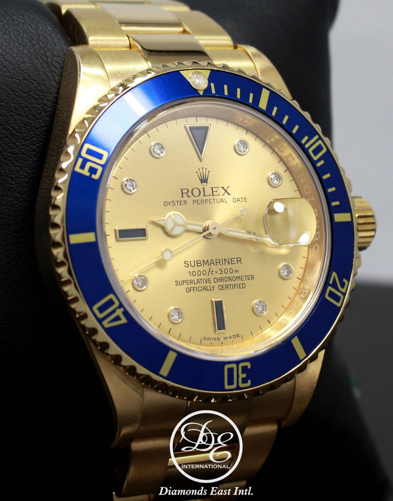 Rolex Submariner 16618 18k Yellow Gold FACTORY SERTI Blue Sapphires Diamonds Dial - Diamonds East Intl.